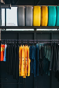 hanged shirts on rack under filed vehicle tires thumbnail