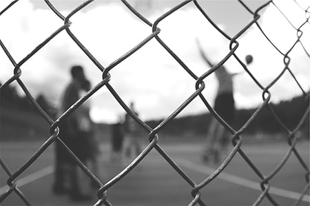 grayscale photography of cyclone fence thumbnail