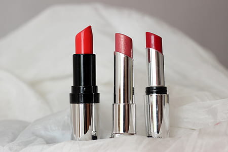 three lipsticks on white surface thumbnail