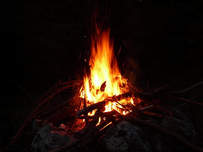 silhouette of lit bonfire thumbnail