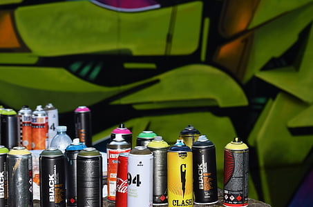assorted-color spray bottle lot on table thumbnail
