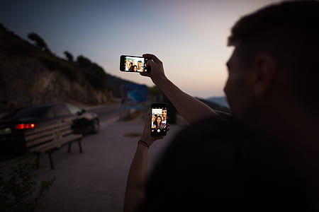 person holding smartphone thumbnail