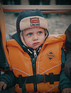 child wearing red and black Fladen personal flotation device thumbnail