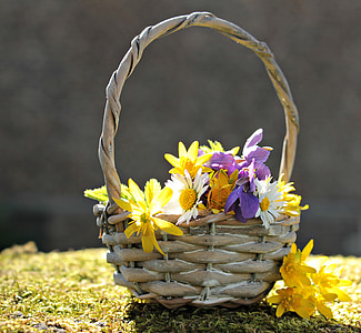 yellow and purple flowers in brown wicker basket thumbnail