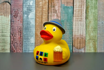 yellow duckling toy on gray surface thumbnail
