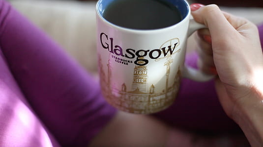 person holding white ceramic mug thumbnail