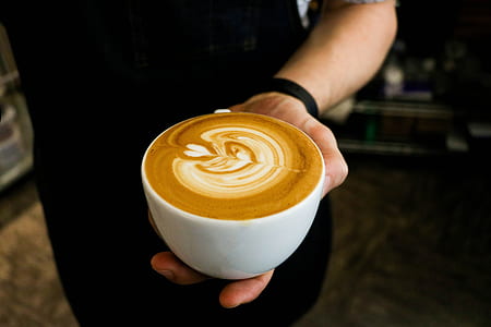 person holding cappuccino cup thumbnail