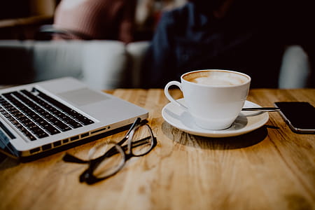 Cup of coffee on table in cafe thumbnail