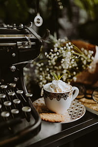 Coffee in a decorative cup with a golden ornament thumbnail