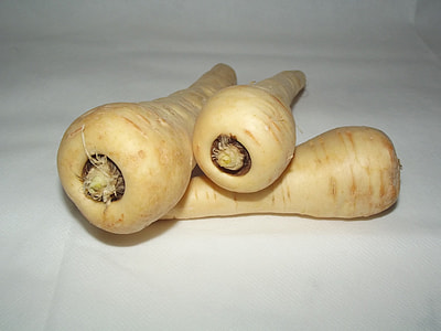 three orange carrots on white cloth thumbnail