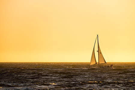 boat sailing on body of water thumbnail