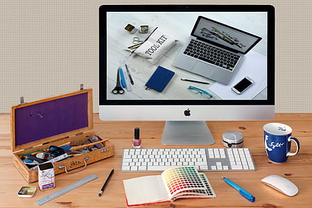 notebook in front of iMac thumbnail