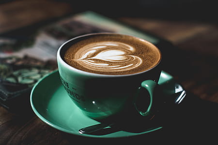 blue ceramic coffee cup on saucer with coffee thumbnail