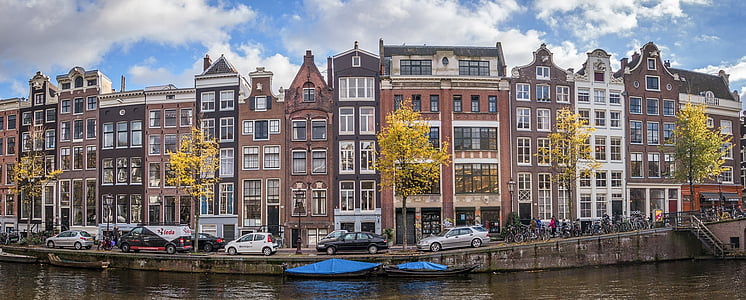 panoramic photography of a bodies of water near mid-rise building thumbnail