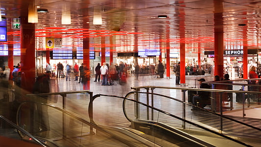 time-lapse photograph of people near escalator thumbnail