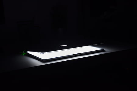 Photography of Macbook Half Opened on White Wooden Surface thumbnail