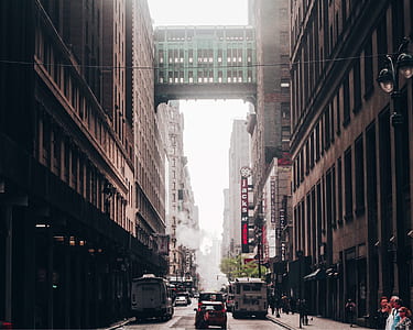 low angle photography of green bridge with several cars on street thumbnail