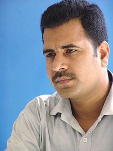 man wearing light-grey collared button-up shirt thumbnail