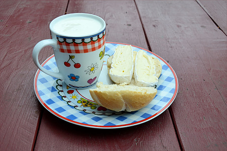 white ceramic mug on blue plate thumbnail