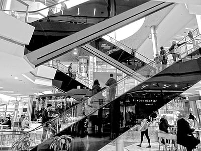 grayscale photograph of people inside building thumbnail
