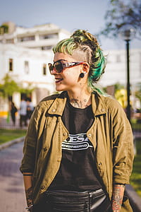 woman wearing brown jacket looking sideways thumbnail