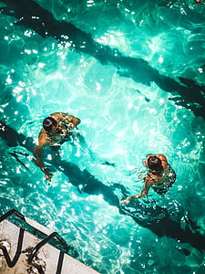 two people swimming on pool thumbnail