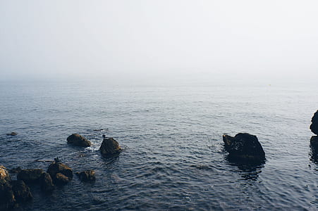 aerial photography of rock formation in the ocean thumbnail
