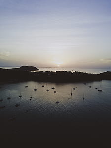 aerial view photo of boats on water under clear sky at daytime thumbnail