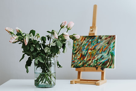 Black cat with flowers and a painting thumbnail