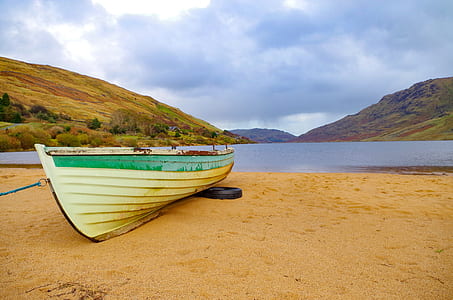 white and green row boat under sunny sky thumbnail