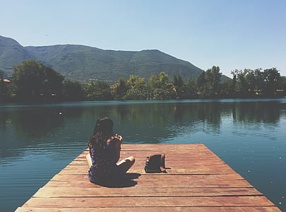person sitting on dock thumbnail