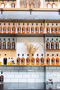 bottles on brown rack thumbnail