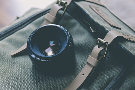 black zoom lens on backpack thumbnail