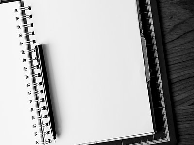 closeup photo of open notebook with pen thumbnail