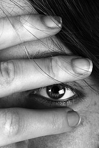 close-up photograph of person covering her eyebrow thumbnail
