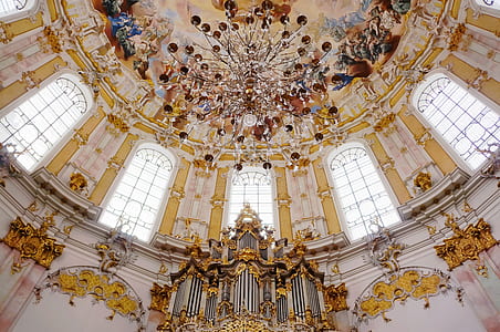 low angle photography of coliseum chandelier and roof thumbnail