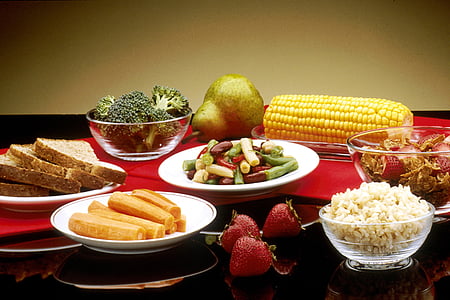 assorted foods with glass and ceramic plates thumbnail