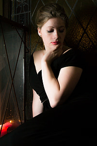 woman leaning on gray wall thumbnail