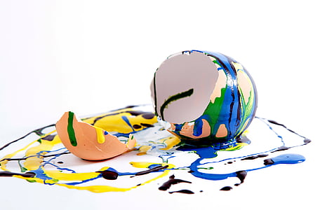 assorted-color cracked egg on white and multicolored surface thumbnail