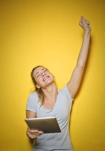 Photo of a Woman Holding an Ipad thumbnail
