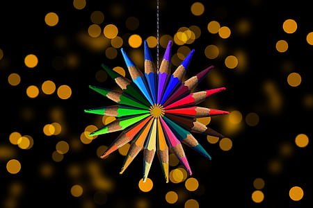 selective focus photography of colored pencil hanging decoration thumbnail