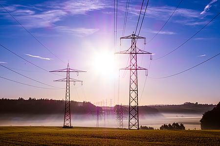 photo of transmission towers near trees thumbnail