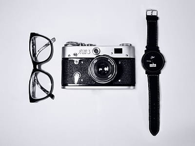 camera in the middle of eyeglasses and wristwatch thumbnail