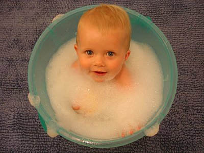 baby's sitting on bubble teal plastic pail container   portrait photography shot thumbnail