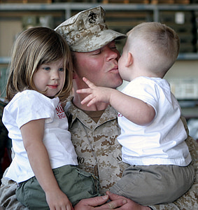 soldier carrying a two babies thumbnail