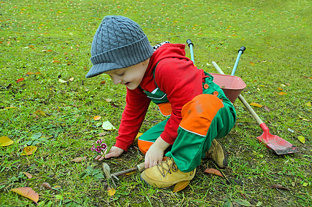 toddler playing in the grass thumbnail