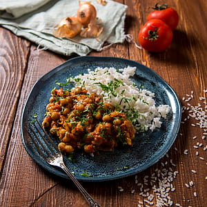round gray ceramic plate with rice and food thumbnail
