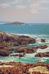 rocky shore and body of water thumbnail