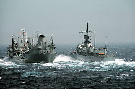 photographed of two gray and white ships thumbnail