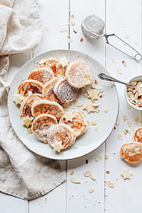 round pastries on white ceramic plate thumbnail